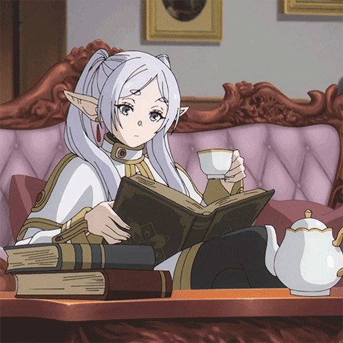 Frieren happily reading a book