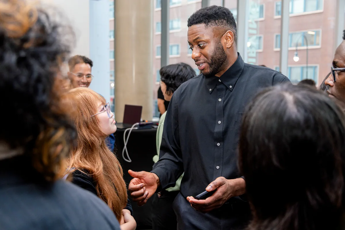 Sweating while explaining something tech related to a a student at SEO TechDevCon in NYC, July 2026