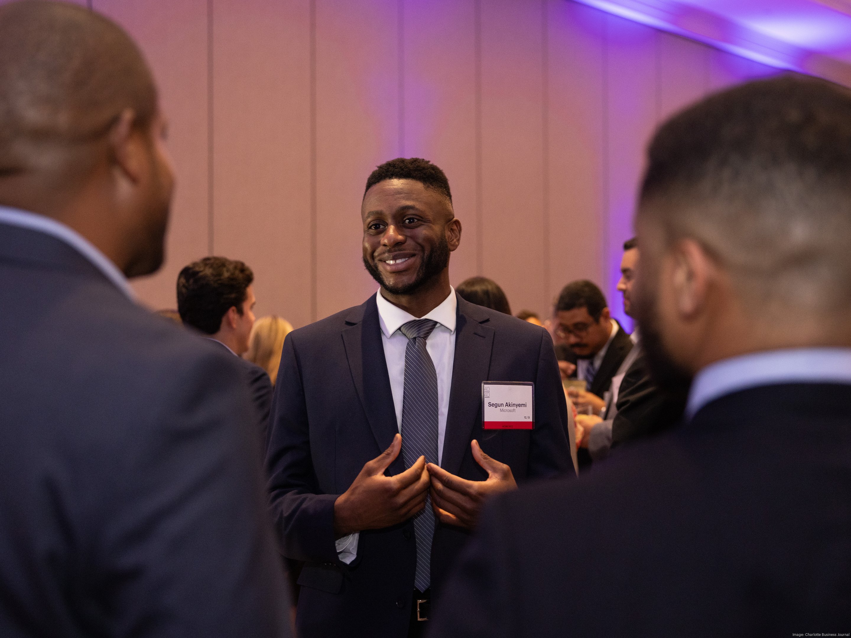 Segun Akinyemi speaking with attendees at the Charlotte Business Journal 40 Under 40 Awards
